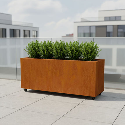 Langwerpige cortenstalen plantenbak met wielen 150x50x60 cm
