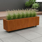Langwerpige cortenstalen plantenbak met wielen 150x40x40 cm